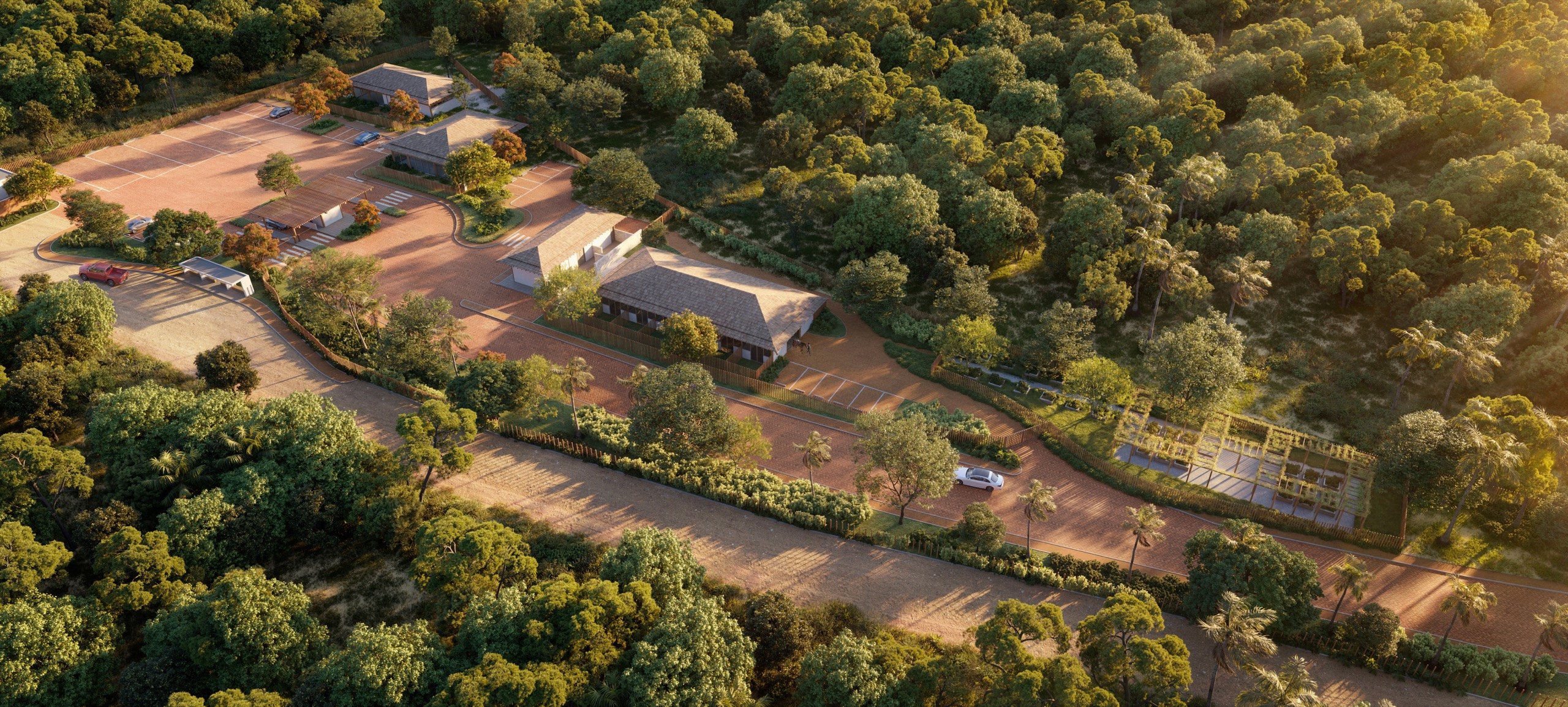 Perspectiva aérea da portaria de serviço de Taípe entre a Mata Atlântica, ao fim da tarde, Trancoso · imagem meramente ilustrativa